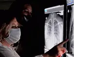 Medical professionals looking at x-rays